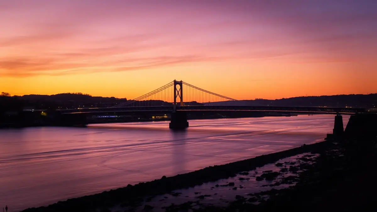 Newport Transporter Bridge over the River Usk at golden hour, Ceejay Intelligence builds custom business software for Newport businesses.